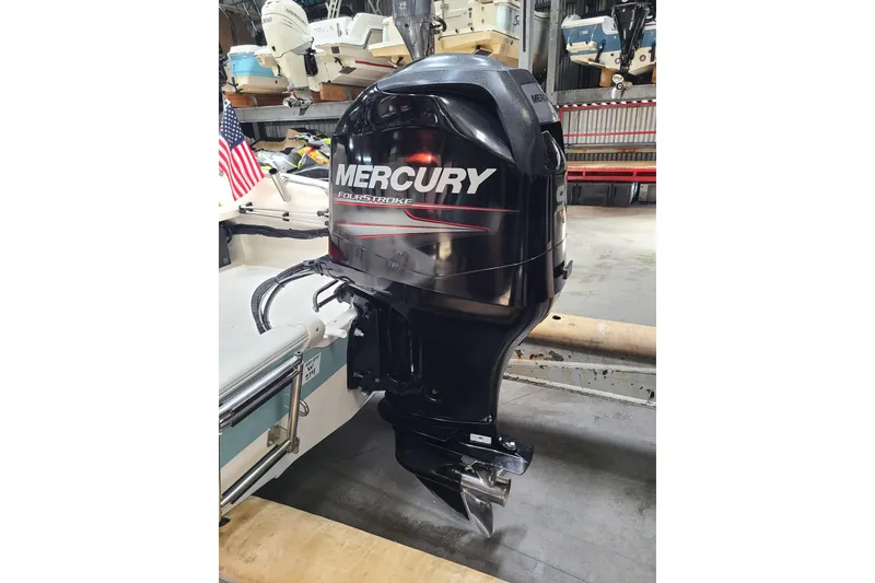 Slide: The Image of 2013 Boston Whaler 170 Super Sport with Mercury FourStroke outboard engine in storage. - 15
