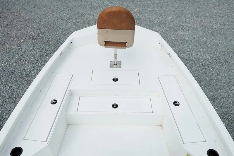 Slide: The Image of 2026 G3 Bay 21 GX Tunnel boat deck with storage compartments and seat. - 15
