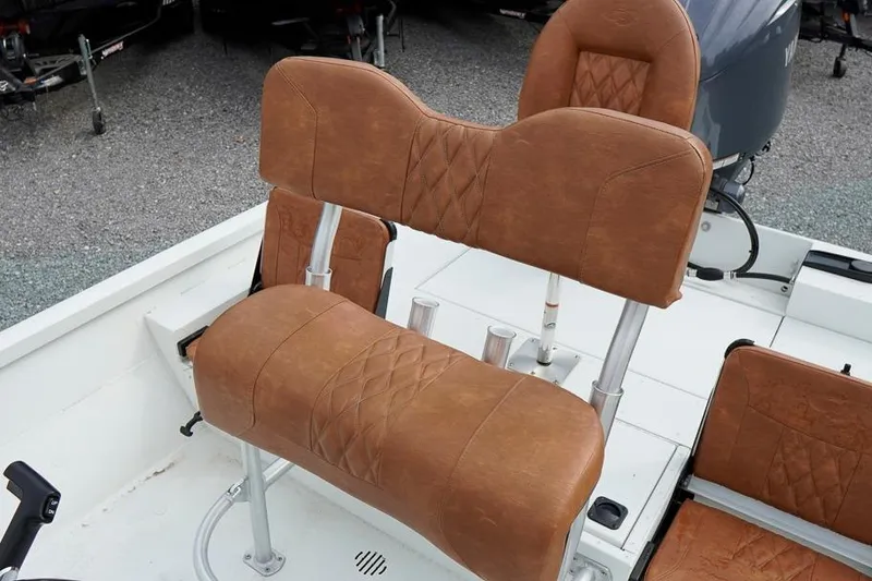 Slide: The Image of 2026 G3 Bay 21 GX Tunnel boat with brown leather seating and modern design. - 17