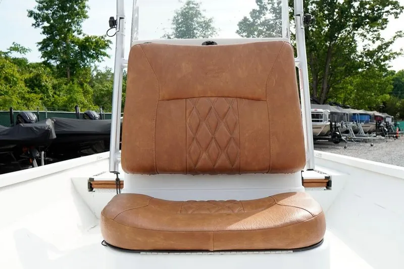 Slide: The Image of 2026 G3 Bay 21 GX Tunnel boat seat with tan leather upholstery and diamond stitching. - 21