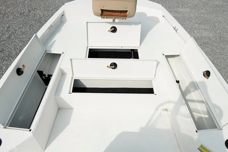 Slide: The Image of 2026 G3 Bay 21 GX Tunnel boat interior with open storage compartments. - 22