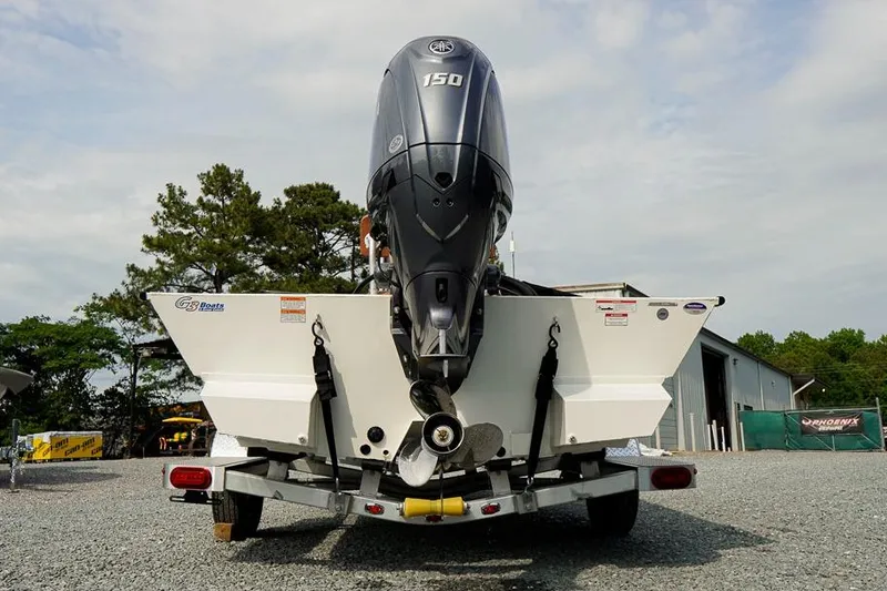 Slide: The Image of 2026 G3 Bay 21 GX Tunnel boat with 150 HP engine on a trailer. - 6