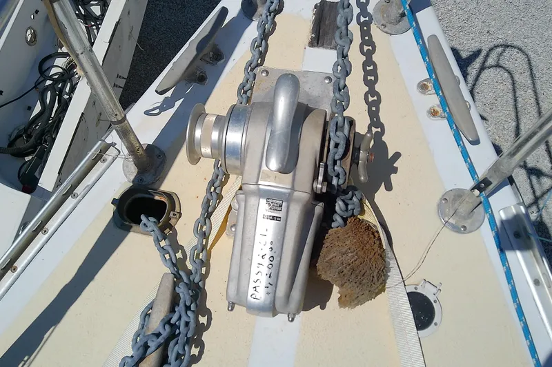Slide: The Image of Anchor windlass on 1972 Morgan Out Island 41 sailboat deck with chain and sponge. - 10