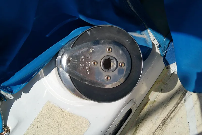 Slide: The Image of Winch on 1972 Morgan Out Island 41 sailboat, featuring blue canvas cover. - 17