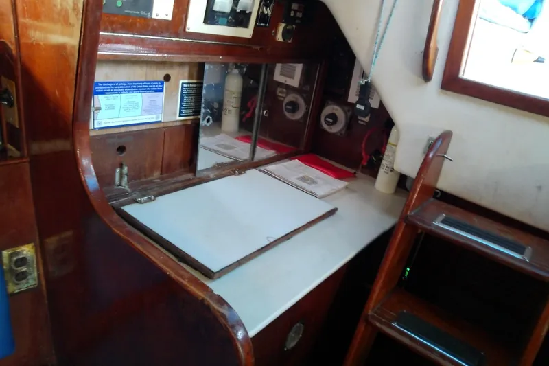 Slide: The Image of 1972 Morgan Out Island 41 yacht interior with navigation station and wooden cabinetry. - 30