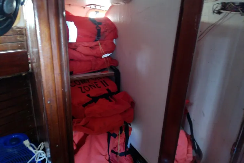 Slide: The Image of Storage area with life jackets on a 1972 Morgan Out Island 41 sailboat. - 35