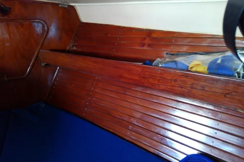 Slide: The Image of Interior of 1972 Morgan Out Island 41 sailboat with polished wooden paneling. - 36