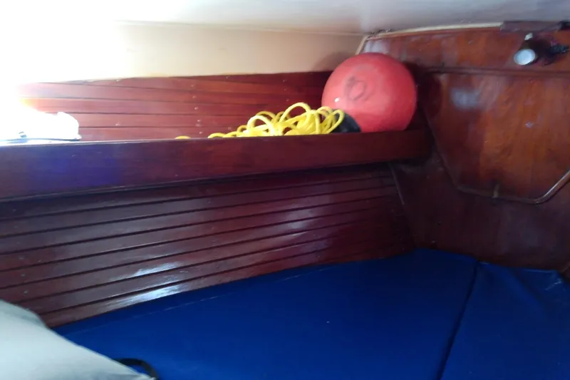 Slide: The Image of Interior cabin of a 1972 Morgan Out Island 41 sailboat with wooden paneling. - 37