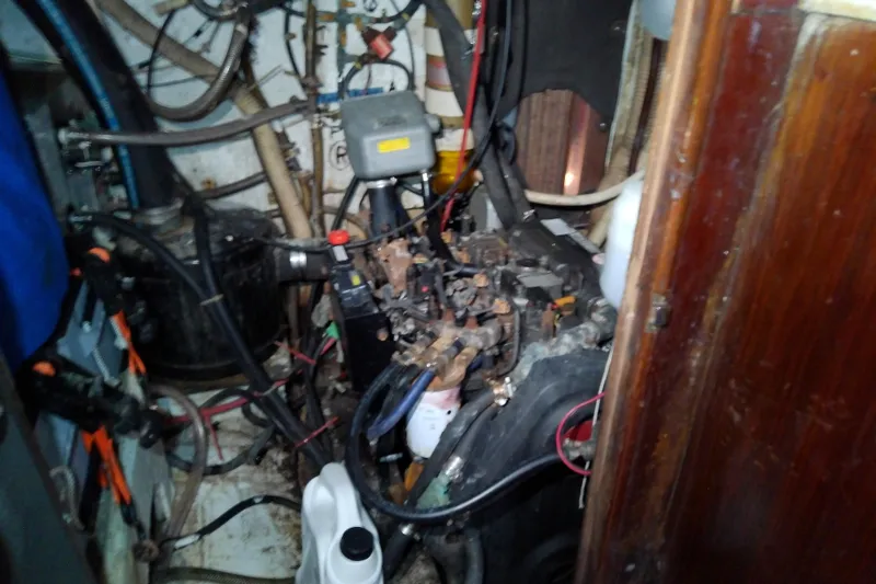 Slide: The Image of Engine room of a 1972 Morgan Out Island 41 sailboat, showing complex wiring and components. - 39