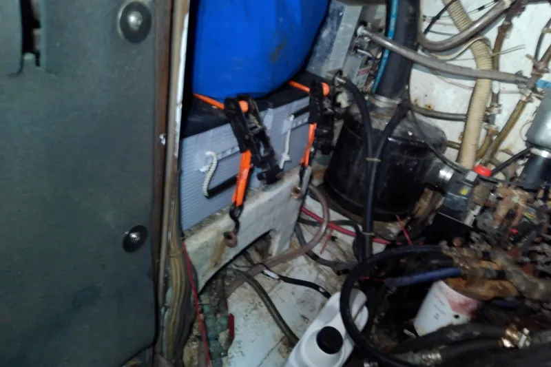 Slide: The Image of Engine compartment of a 1972 Morgan Out Island 41 sailboat, showing mechanical components and wiring. - 40