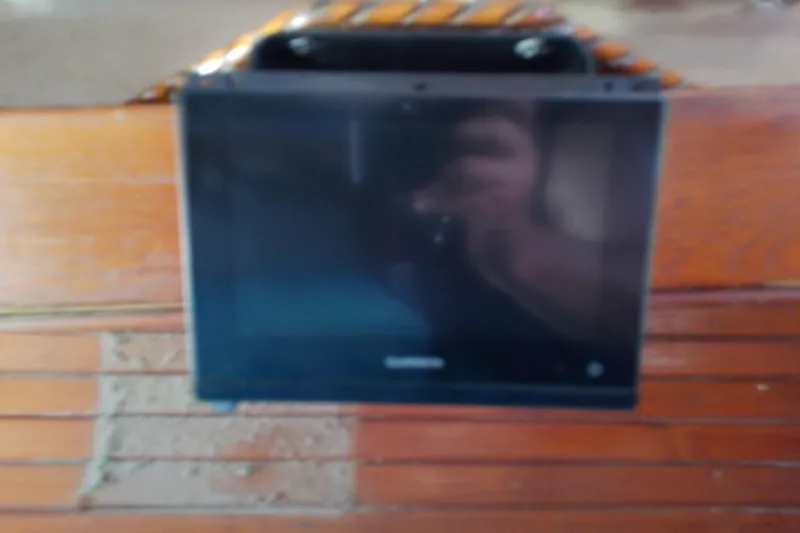 Slide: The Image of Blurred screen on wooden surface, possibly inside a 1972 Morgan Out Island 41 boat. - 48