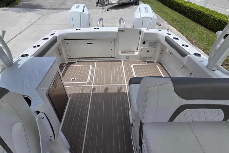Slide: The Image of 2023 World Cat 280 DC-X boat interior with sleek seating and modern design. - 27
