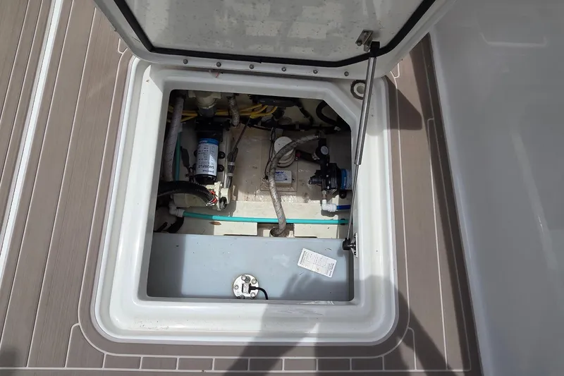 Slide: The Image of Open hatch of 2023 World Cat 280 DC-X boat showing internal components. - 31