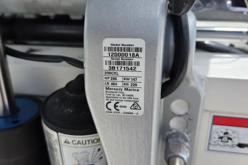 Slide: The Image of Label on a 2023 World Cat 280 DC-X boat, showing Mercury Marine engine specifications. - 8