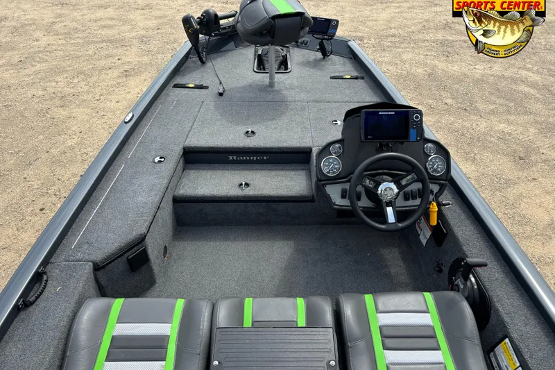 Slide: The Image of 2021 Ranger RT178 boat interior with steering console and seating, featuring green accents. - 5