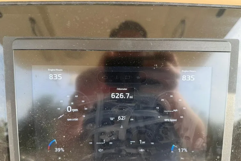 Slide: The Image of Dashboard of a 2019 Scout 275 LXF showing 835 engine hours and 626.7 miles. - 15