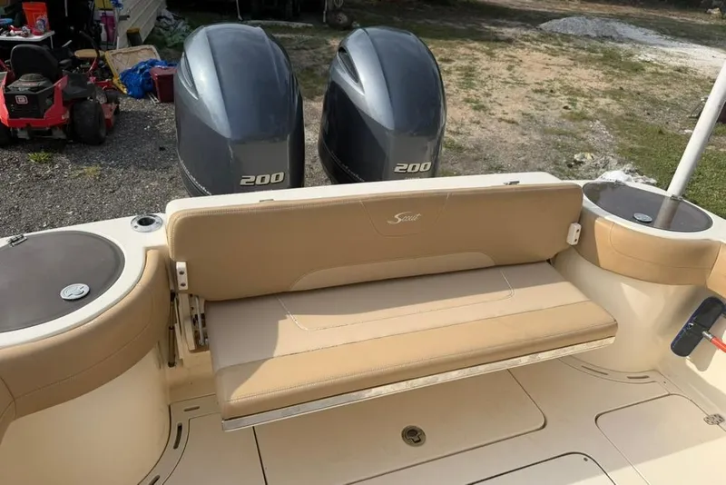 Slide: The Image of 2019 Scout 275 LXF boat with twin 200 horsepower engines and beige seating. - 5