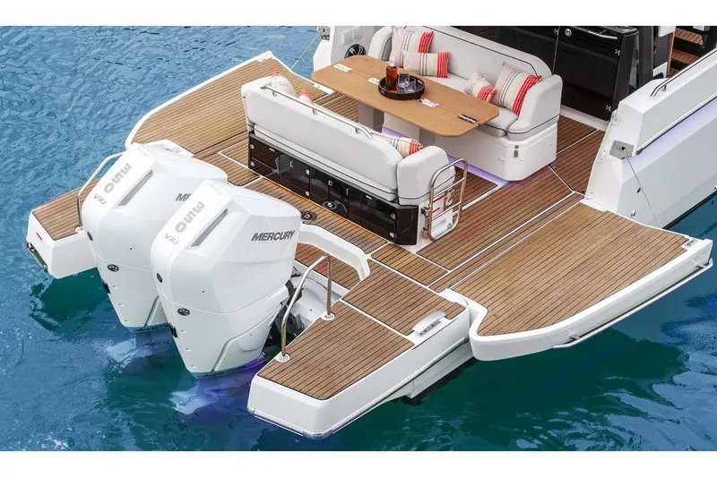 Slide: The Image of Manufacturer Provided Image: 2025 Beneteau Gran Turismo 35 yacht with twin Mercury outboard engines and elegant deck seating. - 2