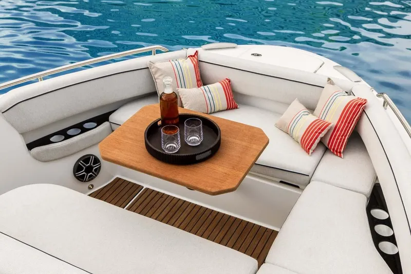 Slide: The Image of Manufacturer Provided Image: Luxurious seating area on 2025 Beneteau Gran Turismo 35 yacht with drinks and cushions. - 4