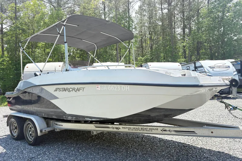 The Image of 2022 Starcraft SVX 191 OB boat on trailer, parked outdoors. - 1