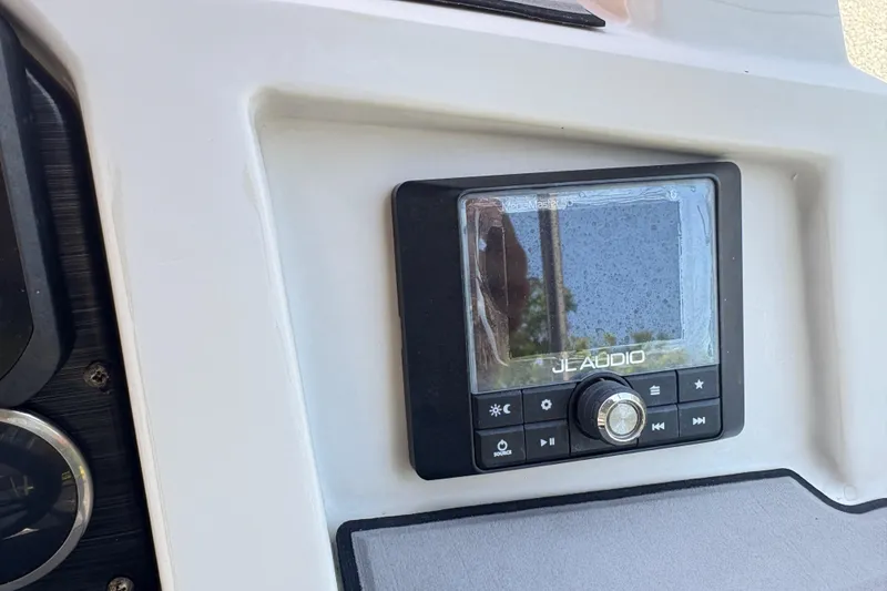 Slide: The Image of JL Audio system on 2022 Starcraft SVX 191 OB boat dashboard. - 13