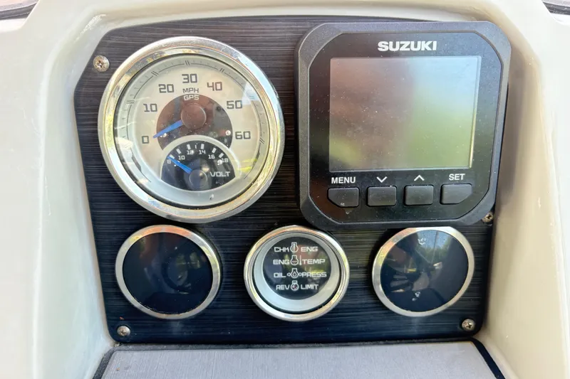 Slide: The Image of Dashboard of 2022 Starcraft SVX 191 OB boat with Suzuki display and gauges. - 14