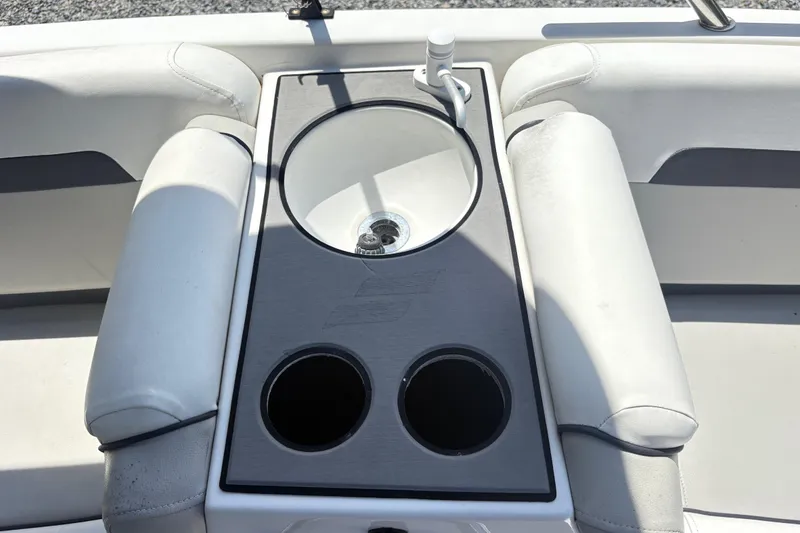 Slide: The Image of 2022 Starcraft SVX 191 OB boat interior with cup holders and sink. - 8
