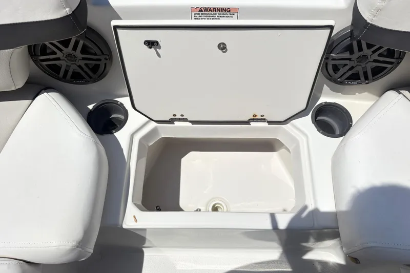 Slide: The Image of Starcraft SVX 191 OB 2022 boat interior with storage compartment and speakers. - 9