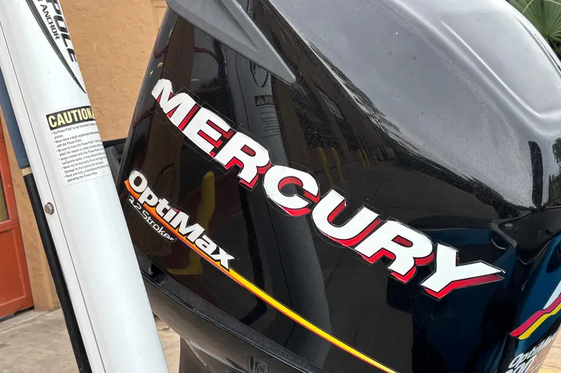 Slide: The Image of Mercury OptiMax 2-Stroke engine on 2009 Triton 22 TrX boat. - 7
