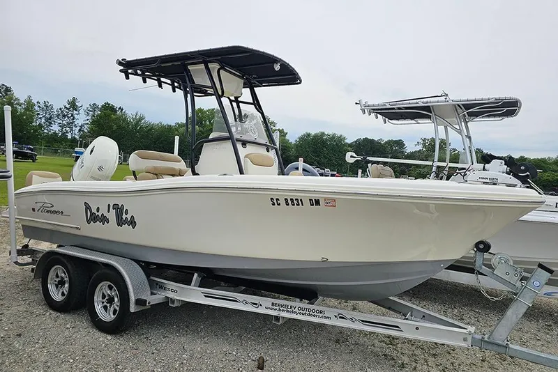 The Image of 2020 Pioneer 202 Sportfish boat on trailer, side view, outdoors. - 1
