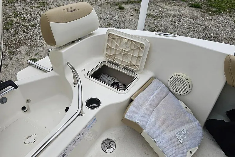 Slide: The Image of 2020 Pioneer 202 Sportfish boat interior with storage compartment and seating. - 10