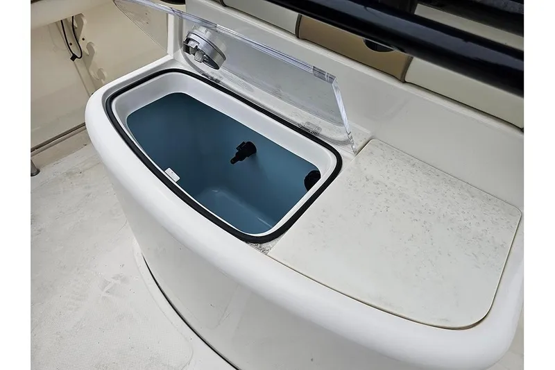 Slide: The Image of Open storage compartment on 2020 Pioneer 202 Sportfish boat. - 12