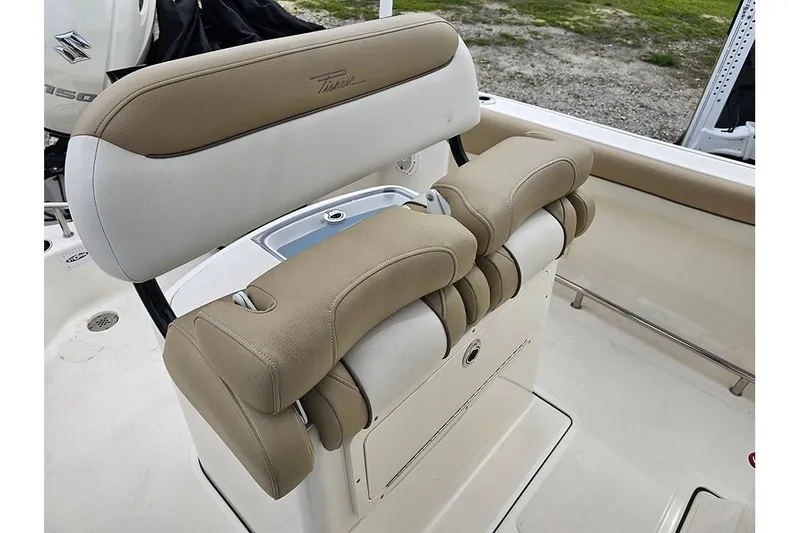 Slide: The Image of 2020 Pioneer 202 Sportfish boat seating with tan and white upholstery. - 13