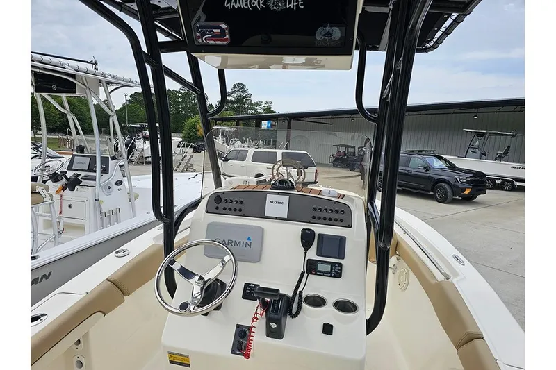 Slide: The Image of 2020 Pioneer 202 Sportfish boat dashboard with Garmin navigation system and steering wheel. - 14
