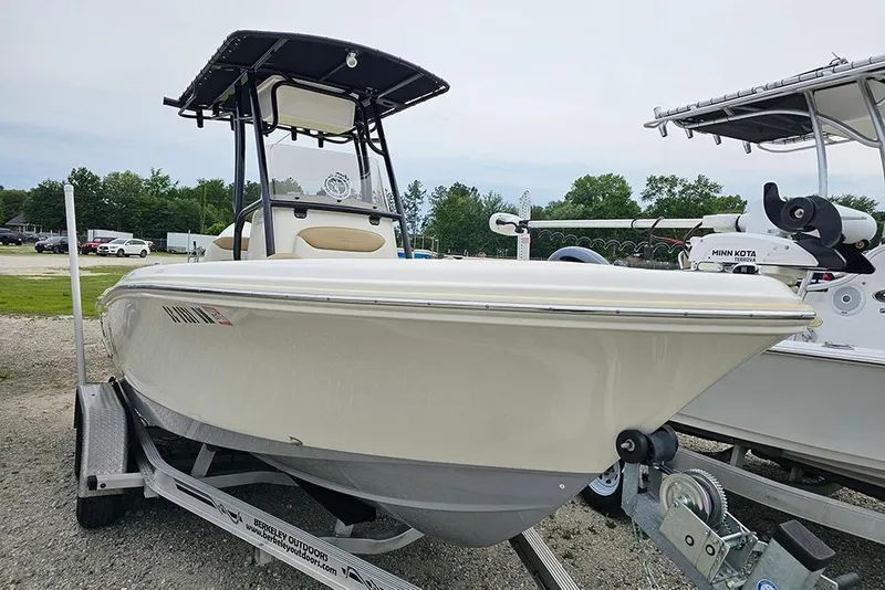 Slide: The Image of 2020 Pioneer 202 Sportfish boat on trailer, parked outdoors. - 2