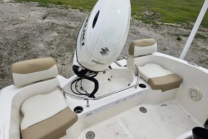 Slide: The Image of 2020 Pioneer 202 Sportfish boat interior with Suzuki engine and cushioned seating. - 8