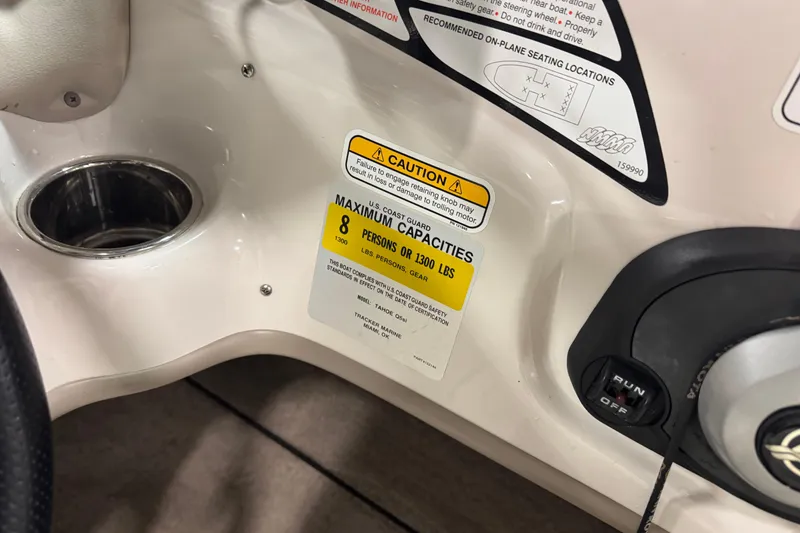 Slide: The Image of 2013 Tahoe Q5i boat capacity label, maximum 8 persons or 1300 lbs. - 6