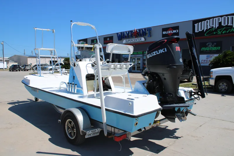 Slide: The Image of 2017 CCB Phoenix boat with Suzuki engine on trailer, parked outside dealership. - 10