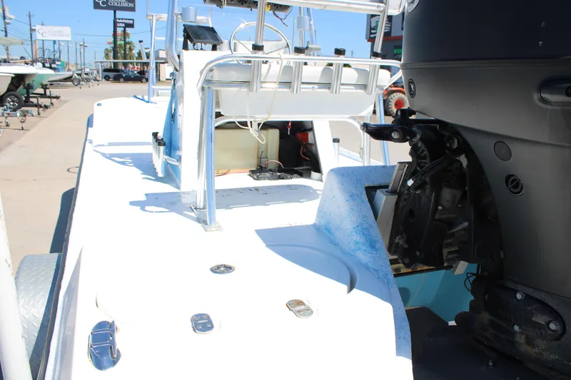 Slide: The Image of 2017 CCB Phoenix boat with outboard motor, docked in a marina under clear skies. - 11