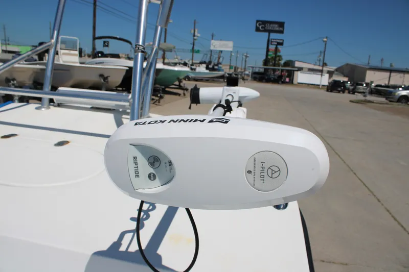 Slide: The Image of Minn Kota Riptide motor on 2017 CCB Phoenix boat, parked outdoors. - 14