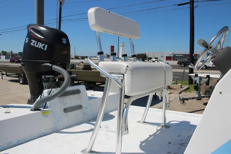 Slide: The Image of 2017 CCB Phoenix boat with Suzuki outboard motor and white seating on a sunny day. - 5