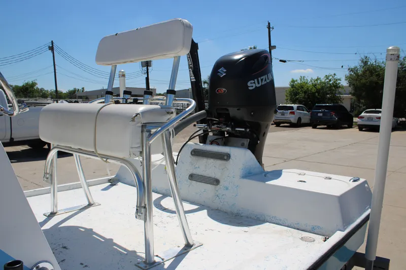 Slide: The Image of 2017 CCB Phoenix boat with Suzuki outboard motor in a parking lot. - 8
