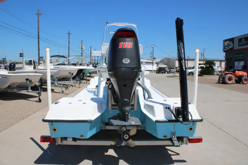 Slide: The Image of Rear view of a 2017 CCB Phoenix boat with a 115 horsepower engine. - 9