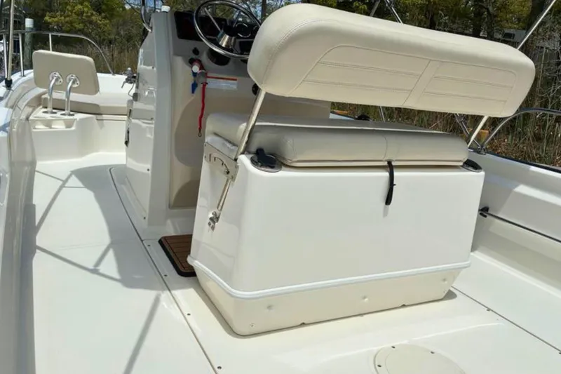 Slide: The Image of 2020 Boston Whaler 210 Montauk boat interior with seating and steering console. - 13