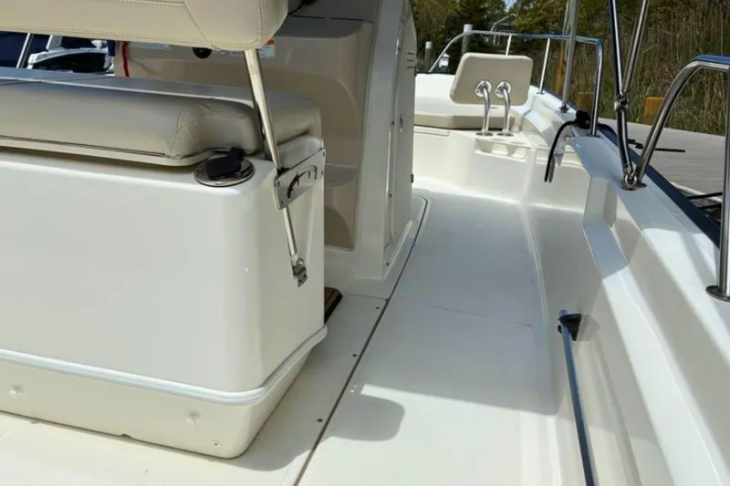 Slide: The Image of 2020 Boston Whaler 210 Montauk boat interior with seating and railings. - 14