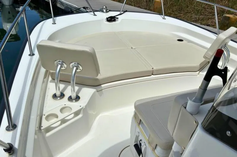 Slide: The Image of 2020 Boston Whaler 210 Montauk boat interior with seating and cup holders. - 20