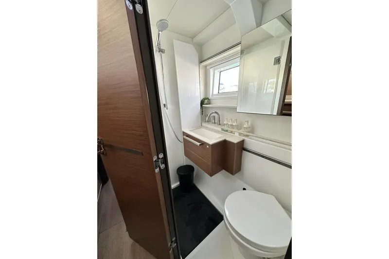 Slide: The Image of Modern bathroom on Lagoon 50 catamaran, year 2023. - 30