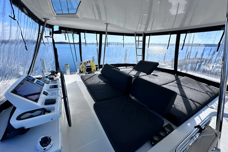 Slide: The Image of Luxurious 2023 Lagoon 50 yacht interior with panoramic views and modern navigation controls. - 8