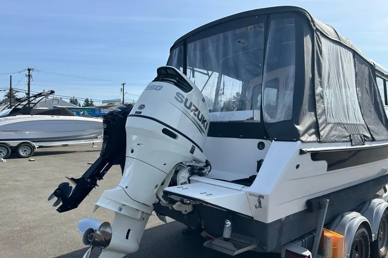 Slide: The Image of 2018 C-Dory 23' Venture boat with Suzuki outboard motor on trailer. - 4