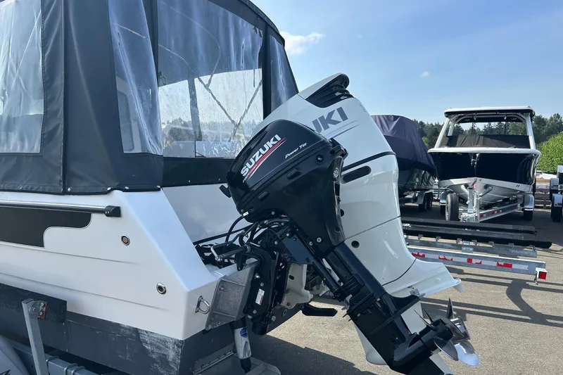 Slide: The Image of 2018 C-Dory 23' Venture boat with Suzuki outboard motor on trailer. - 5